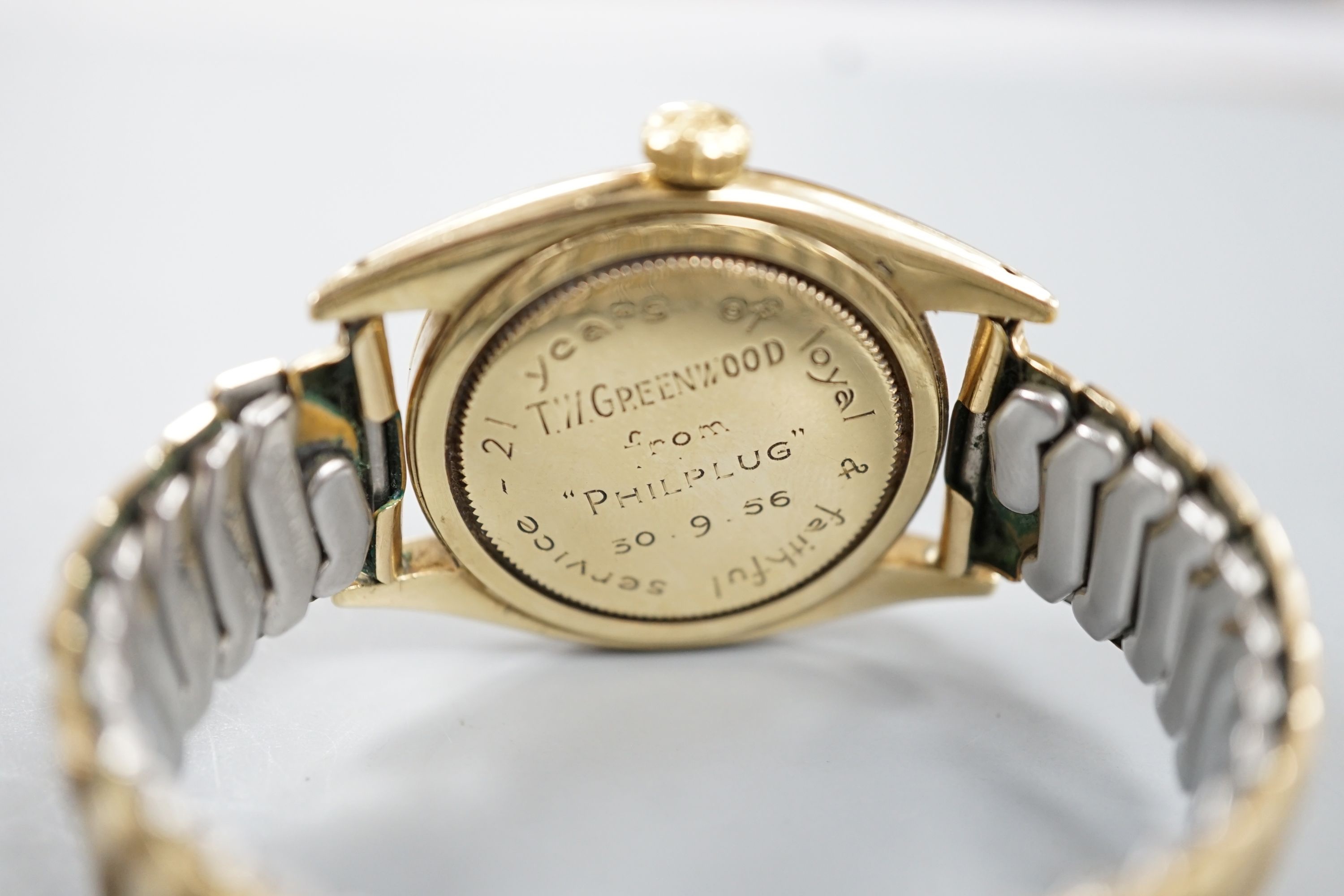 A gentleman's 1950's 9ct gold Rolex Oyster Precision manual wind wrist watch, with honeycomb dial and baton numerals, on associated expanding bracelet, case diameter 35mm, with personalised inscription to case back, no b